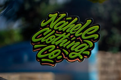 Nāhele Clothing Co. “Concrete Bloom” Sticker - Nāhele Clothing Co. - Nahele Co. - Nahele Clothing Co. - Sticker with 'Nahele Clothing Co.' text on a blurred background